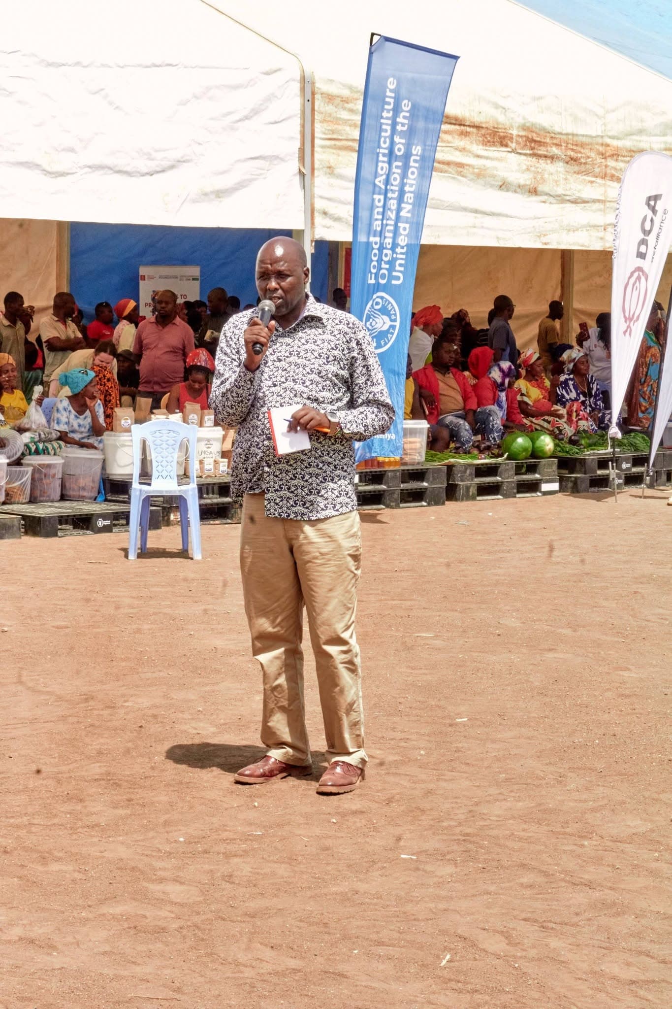 A young person speaking to visitors