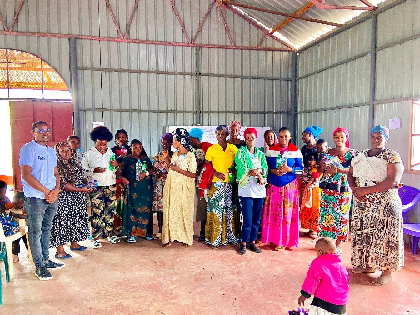 A volunteer and learners talking together